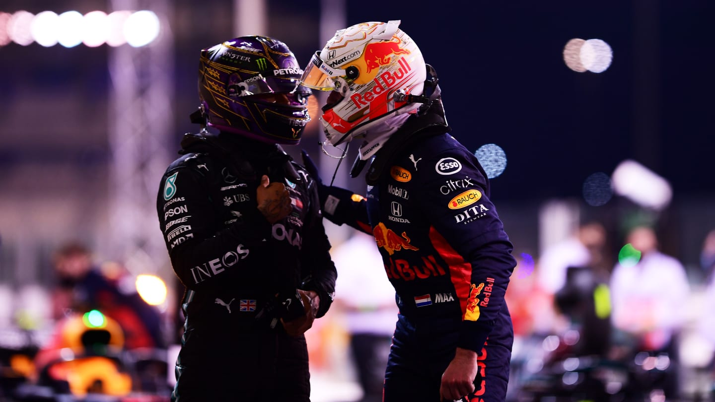 ABU DHABI, UNITED ARAB EMIRATES - DECEMBER 12: Pole position qualifier Max Verstappen of Netherlands and Red Bull Racing is congratulated by third placed qualifier Lewis Hamilton of Great Britain and Mercedes GP in parc ferme during qualifying ahead of the F1 Grand Prix of Abu Dhabi at Yas Marina Circuit on December 12, 2020 in Abu Dhabi, United Arab Emirates. (Photo by Mario Renzi - Formula 1/Formula 1 via Getty Images)