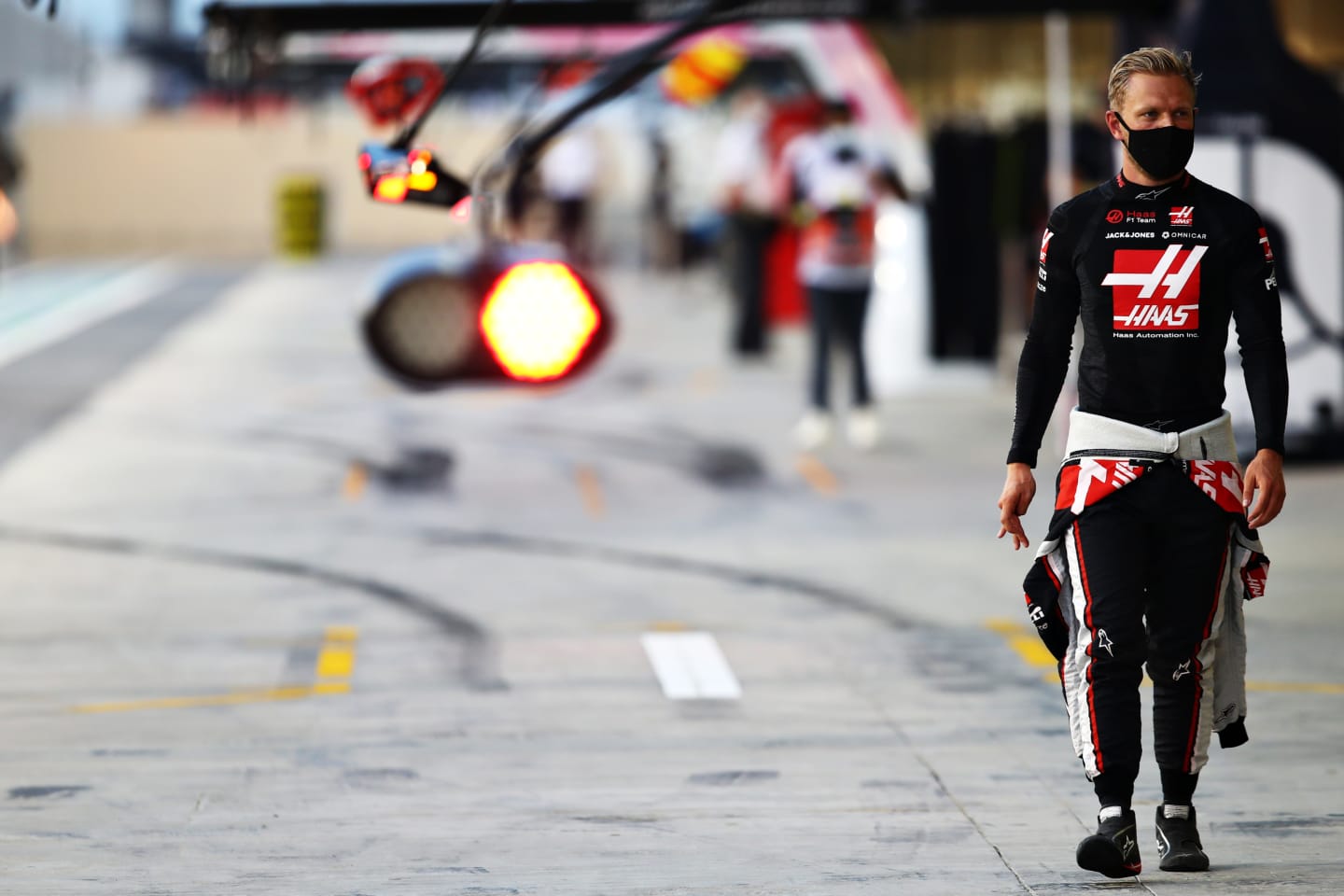 ABU DHABI, UNITED ARAB EMIRATES - DECEMBER 12: Kevin Magnussen of Denmark and Haas F1 walks in the