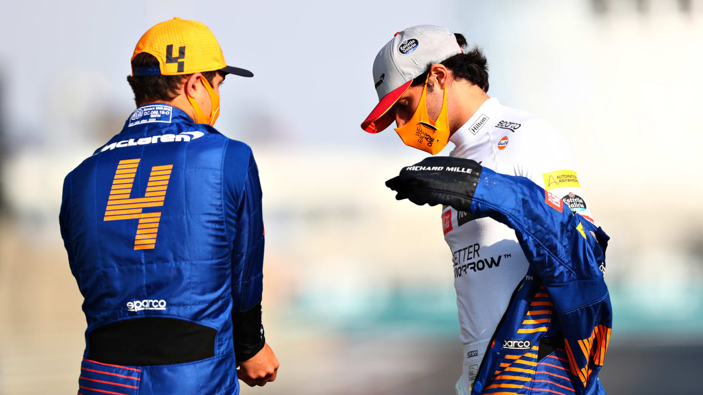 ABU DHABI, UNITED ARAB EMIRATES - DECEMBER 13: Carlos Sainz of Spain and McLaren F1 talks with teammate Lando Norris of Great Britain and McLaren F1 on the grid prior to the F1 Grand Prix of Abu Dhabi at Yas Marina Circuit on December 13, 2020 in Abu Dhabi, United Arab Emirates. (Photo by Dan Istitene - Formula 1/Formula 1 via Getty Images)