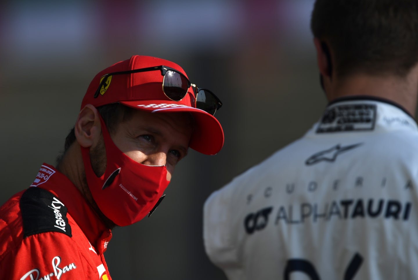 ABU DHABI, UNITED ARAB EMIRATES - DECEMBER 13: Sebastian Vettel of Germany and Ferrari talks with