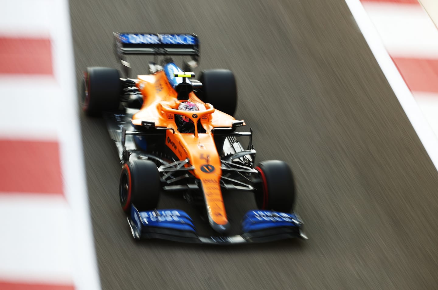 ABU DHABI, UNITED ARAB EMIRATES - DECEMBER 13: Lando Norris of Great Britain driving the (4) McLaren F1 Team MCL35 Renault on his way to the grid prior to the F1 Grand Prix of Abu Dhabi at Yas Marina Circuit on December 13, 2020 in Abu Dhabi, United Arab Emirates. (Photo by Bryn Lennon/Getty Images)