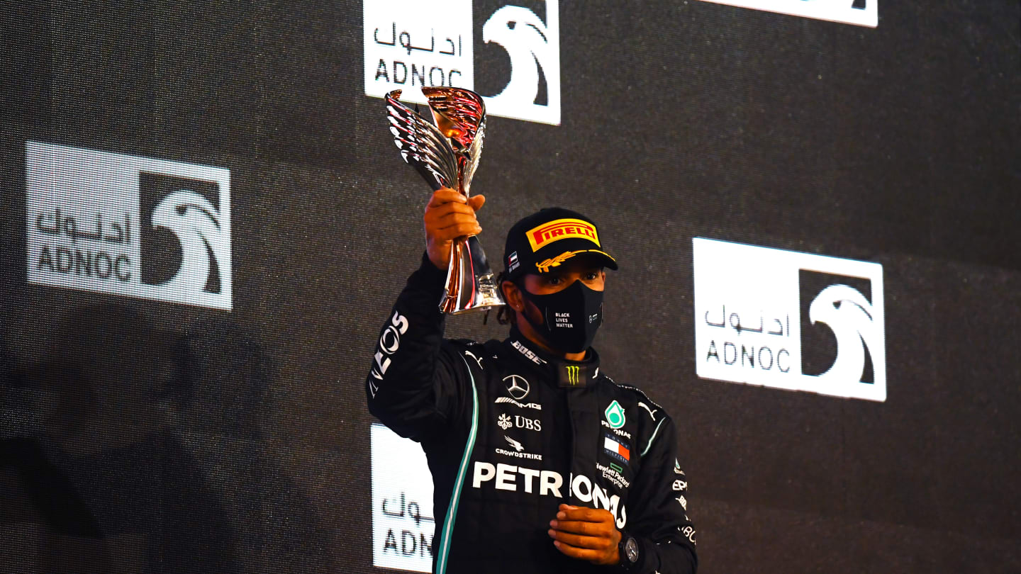 ABU DHABI, UNITED ARAB EMIRATES - DECEMBER 13: Third placed Lewis Hamilton of Great Britain and