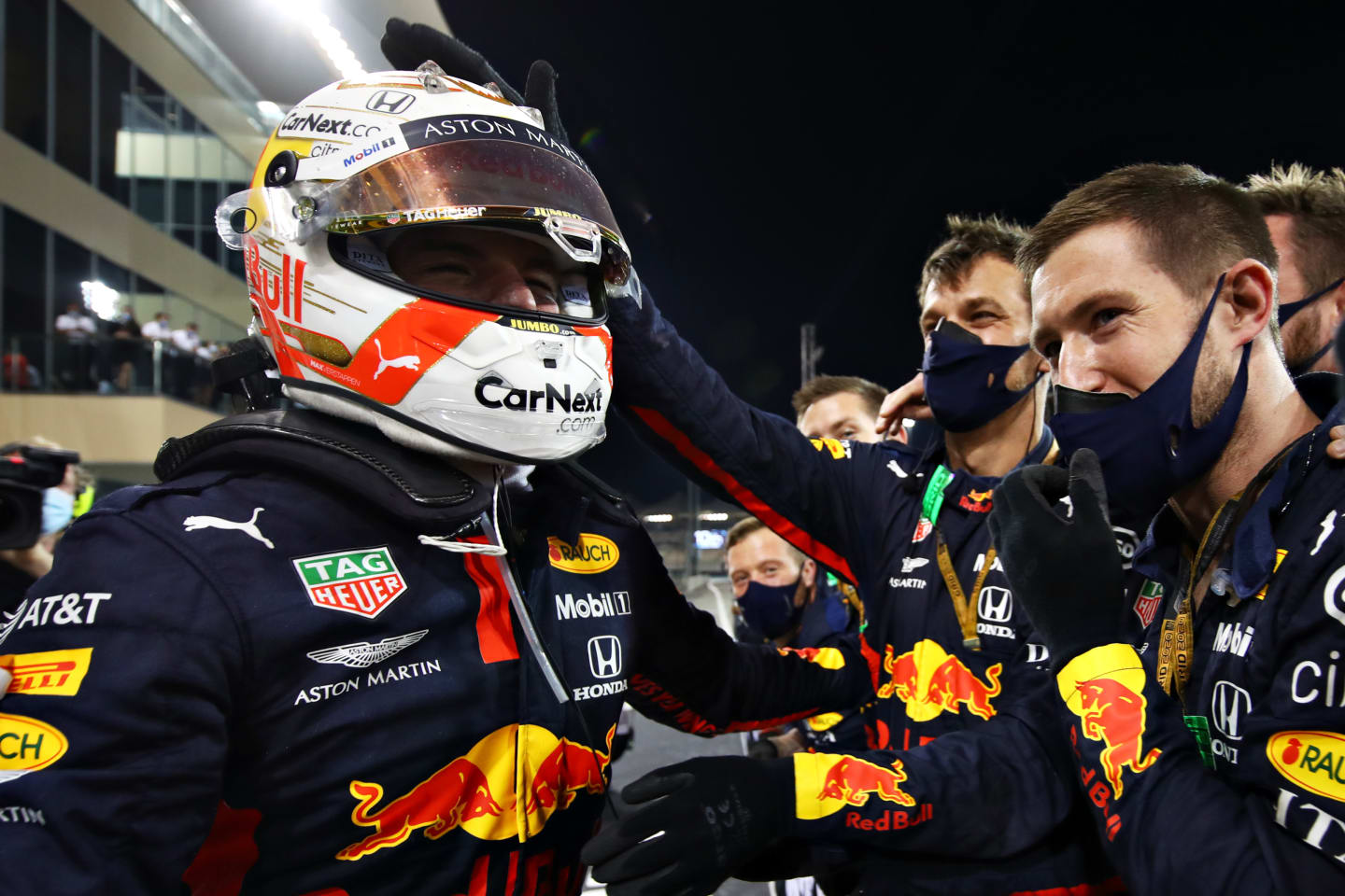 ABU DHABI, UNITED ARAB EMIRATES - DECEMBER 13: Race winner Max Verstappen of Netherlands and Red Bull Racing celebrates with his team in parc ferme during the F1 Grand Prix of Abu Dhabi at Yas Marina Circuit on December 13, 2020 in Abu Dhabi, United Arab Emirates. (Photo by Mark Thompson/Getty Images)