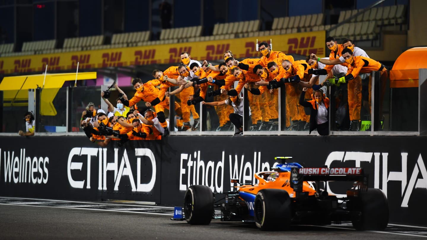 ABU DHABI, UNITED ARAB EMIRATES - DECEMBER 13: The McLaren team celebrate as fifth placed Lando