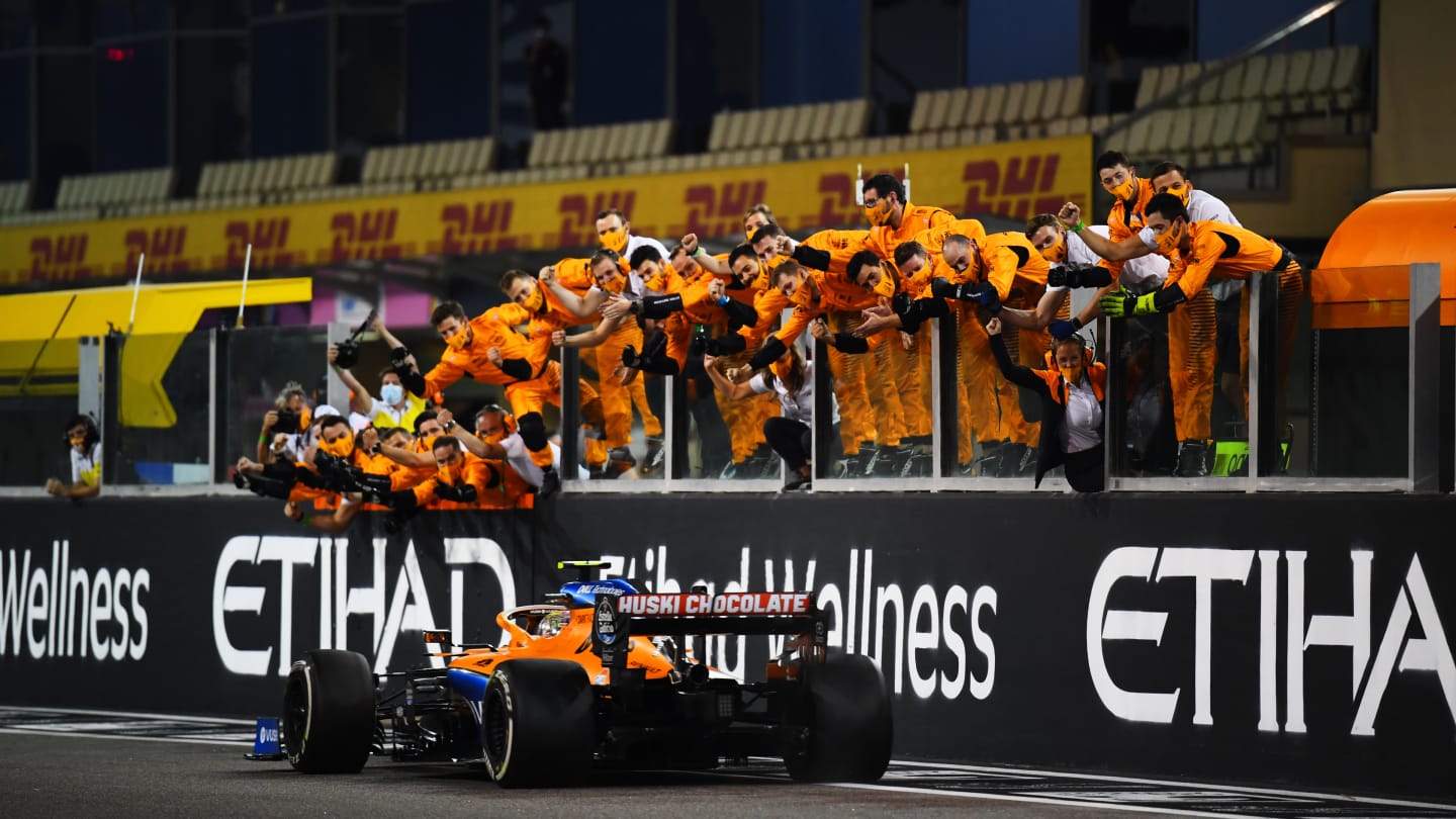 ABU DHABI, UNITED ARAB EMIRATES - DECEMBER 13: The McLaren team celebrate as fifth placed Lando