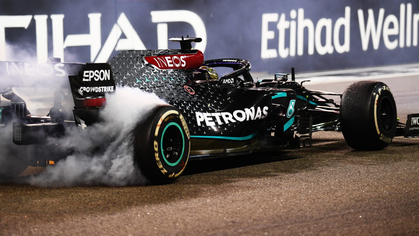 ABU DHABI, UNITED ARAB EMIRATES - DECEMBER 13: Third placed Lewis Hamilton of Great Britain driving the (44) Mercedes AMG Petronas F1 Team Mercedes W11 does donuts after the F1 Grand Prix of Abu Dhabi at Yas Marina Circuit on December 13, 2020 in Abu Dhabi, United Arab Emirates. (Photo by Clive Mason - Formula 1/Formula 1 via Getty Images)