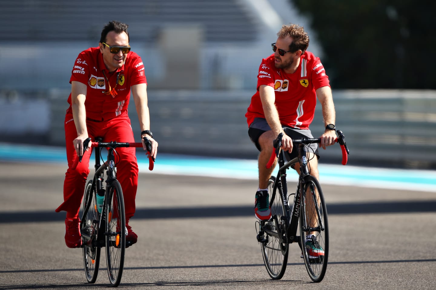 ABU DHABI, UNITED ARAB EMIRATES - DECEMBER 10: Sebastian Vettel of Germany and Ferrari cycles the