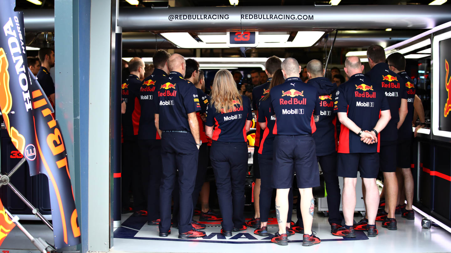 MELBOURNE, AUSTRALIA - MARCH 13: Red Bull Racing team members stand in the garage before practice
