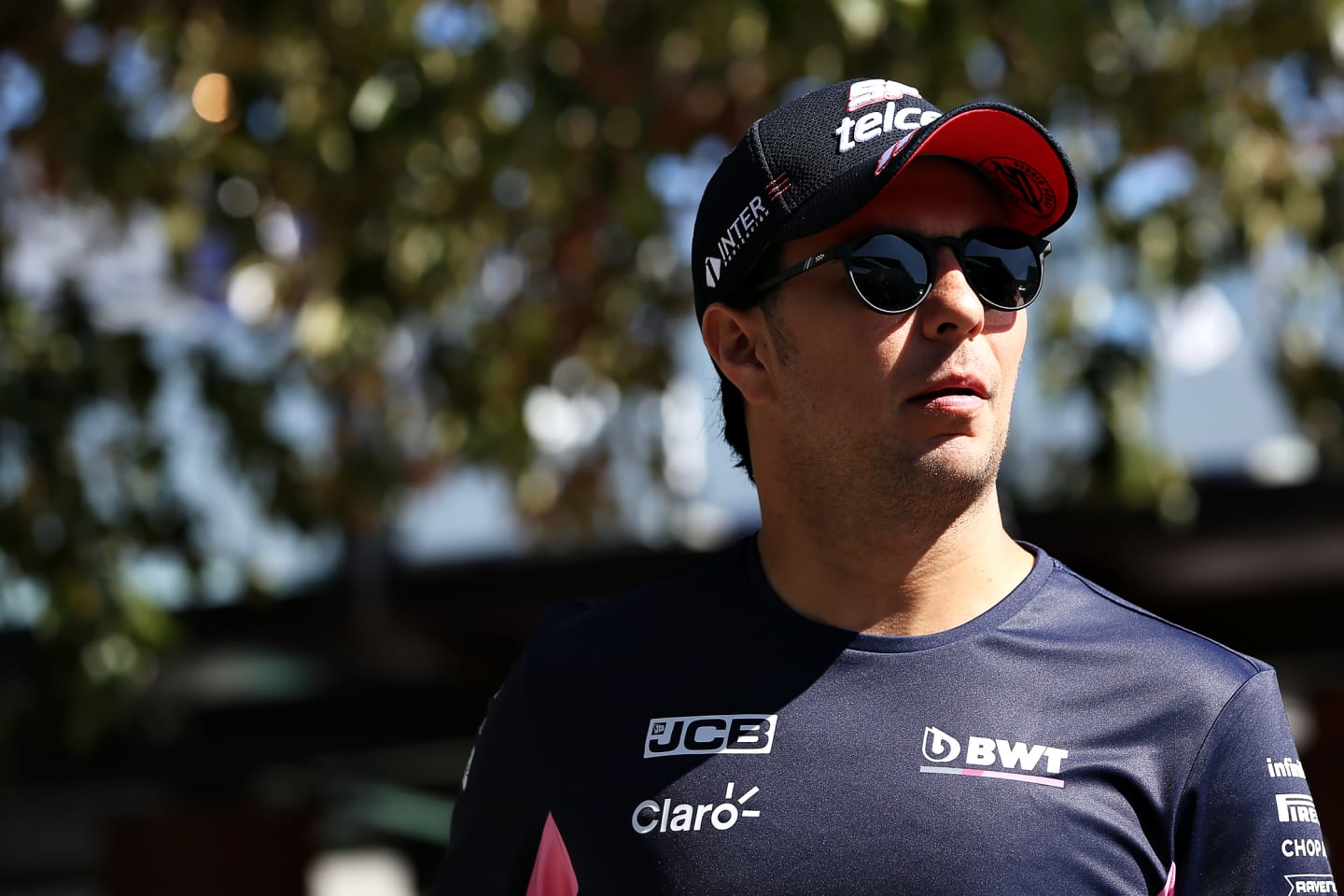 MELBOURNE, AUSTRALIA - MARCH 12: Sergio Perez of Mexico and Racing Point walks in the Paddock