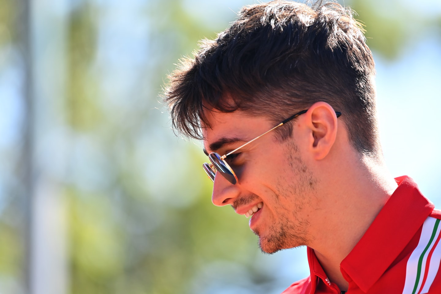 MELBOURNE, AUSTRALIA - MARCH 12: Charles Leclerc of Monaco and Ferrari walks in the Paddock during