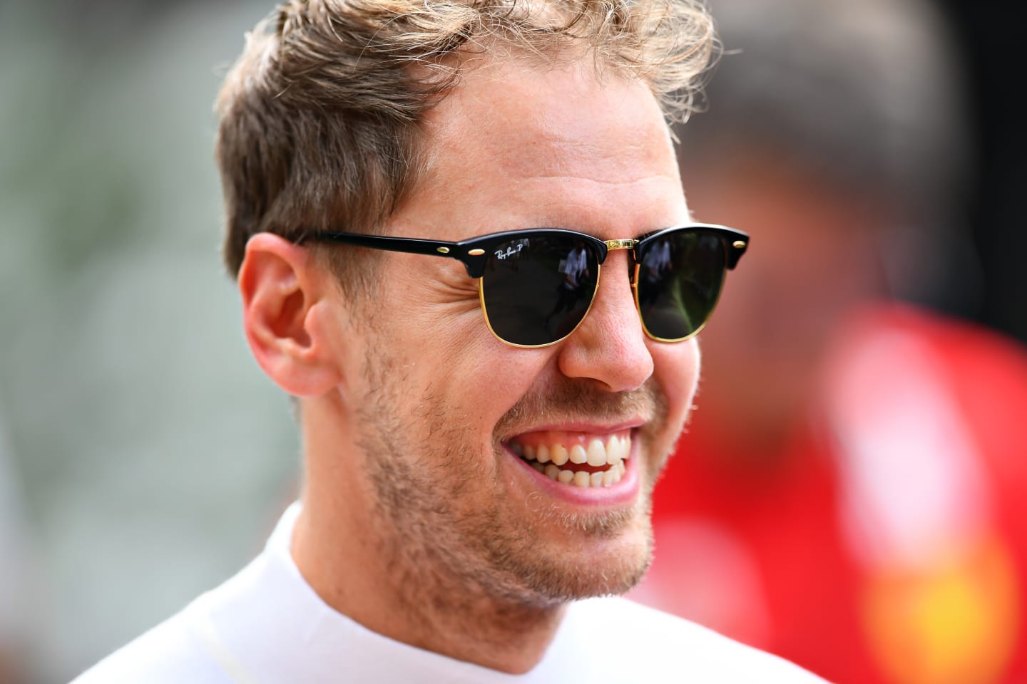 MELBOURNE, AUSTRALIA - MARCH 12: Sebastian Vettel of Germany and Ferrari walks in the Paddock
