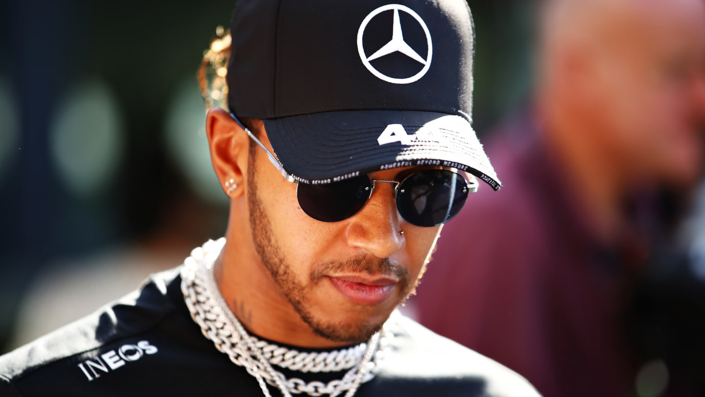 MELBOURNE, AUSTRALIA - MARCH 12: Lewis Hamilton of Great Britain and Mercedes GP walks in the