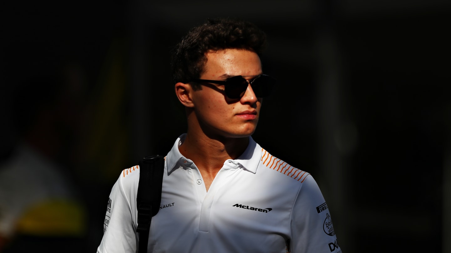 MELBOURNE, AUSTRALIA - MARCH 12: Lando Norris of Great Britain and McLaren F1 walks in the Paddock