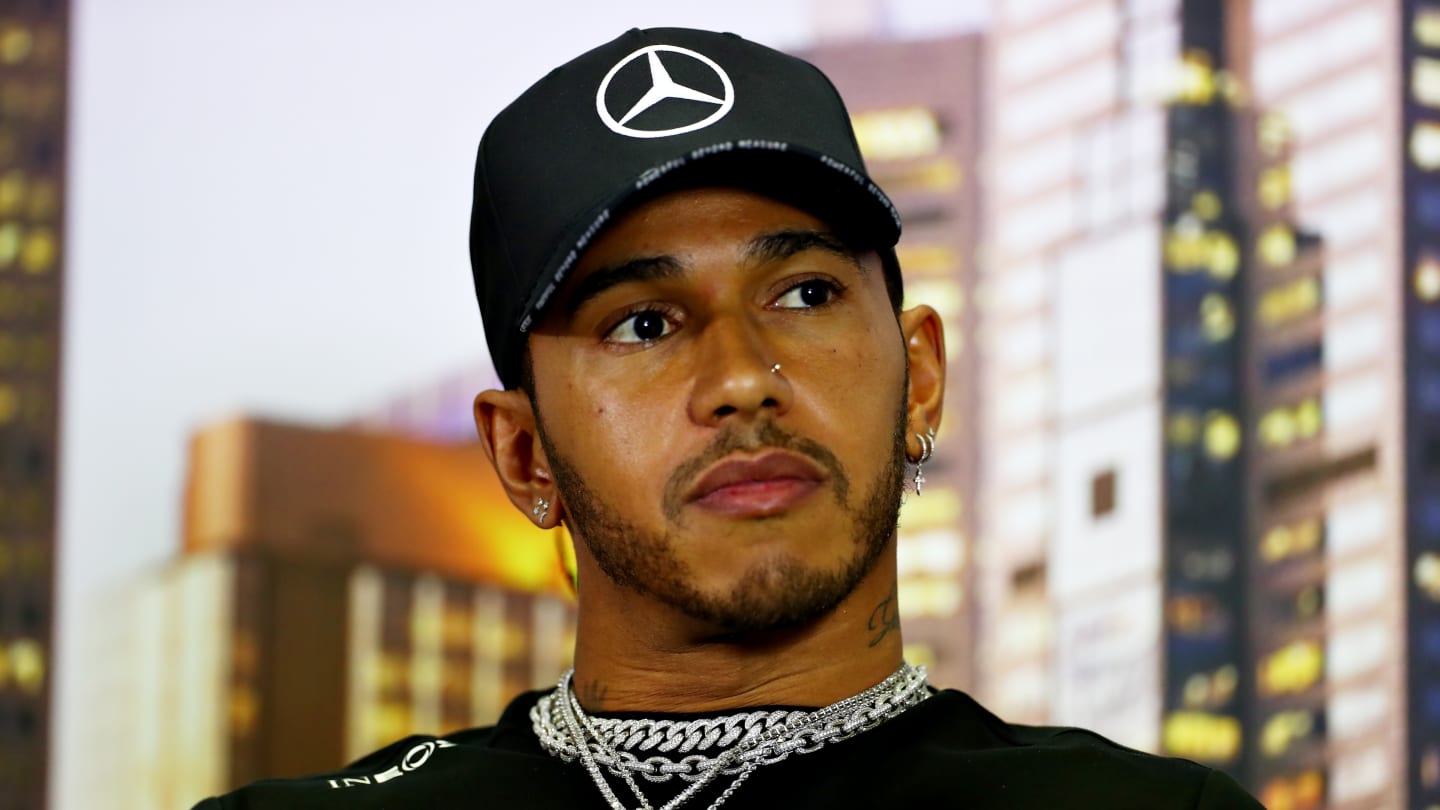 MELBOURNE, AUSTRALIA - MARCH 12: Lewis Hamilton of Great Britain and Mercedes GP looks on in the