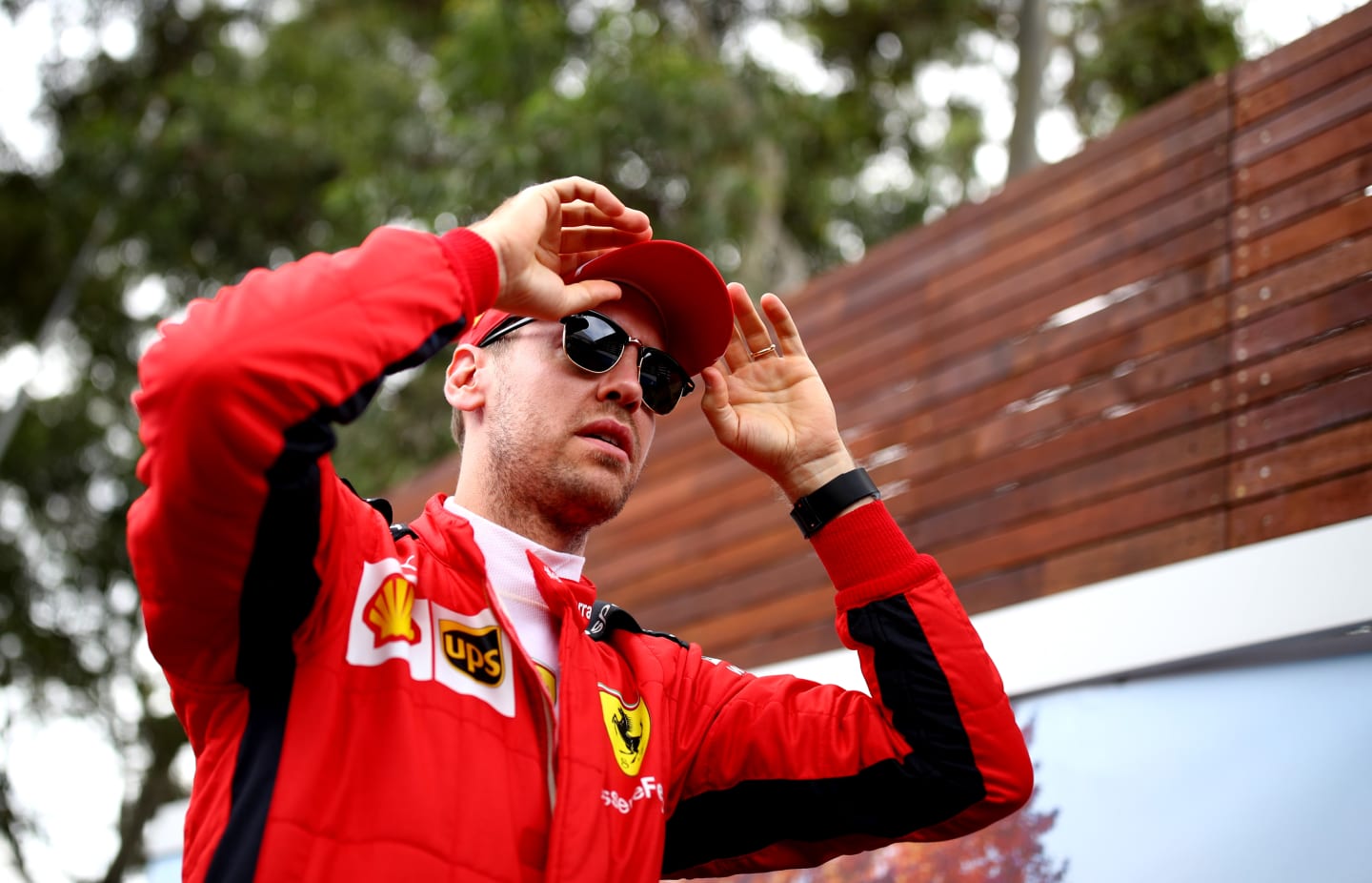 MELBOURNE, AUSTRALIA - MARCH 12: Sebastian Vettel of Germany and Ferrari looks on in the Paddock