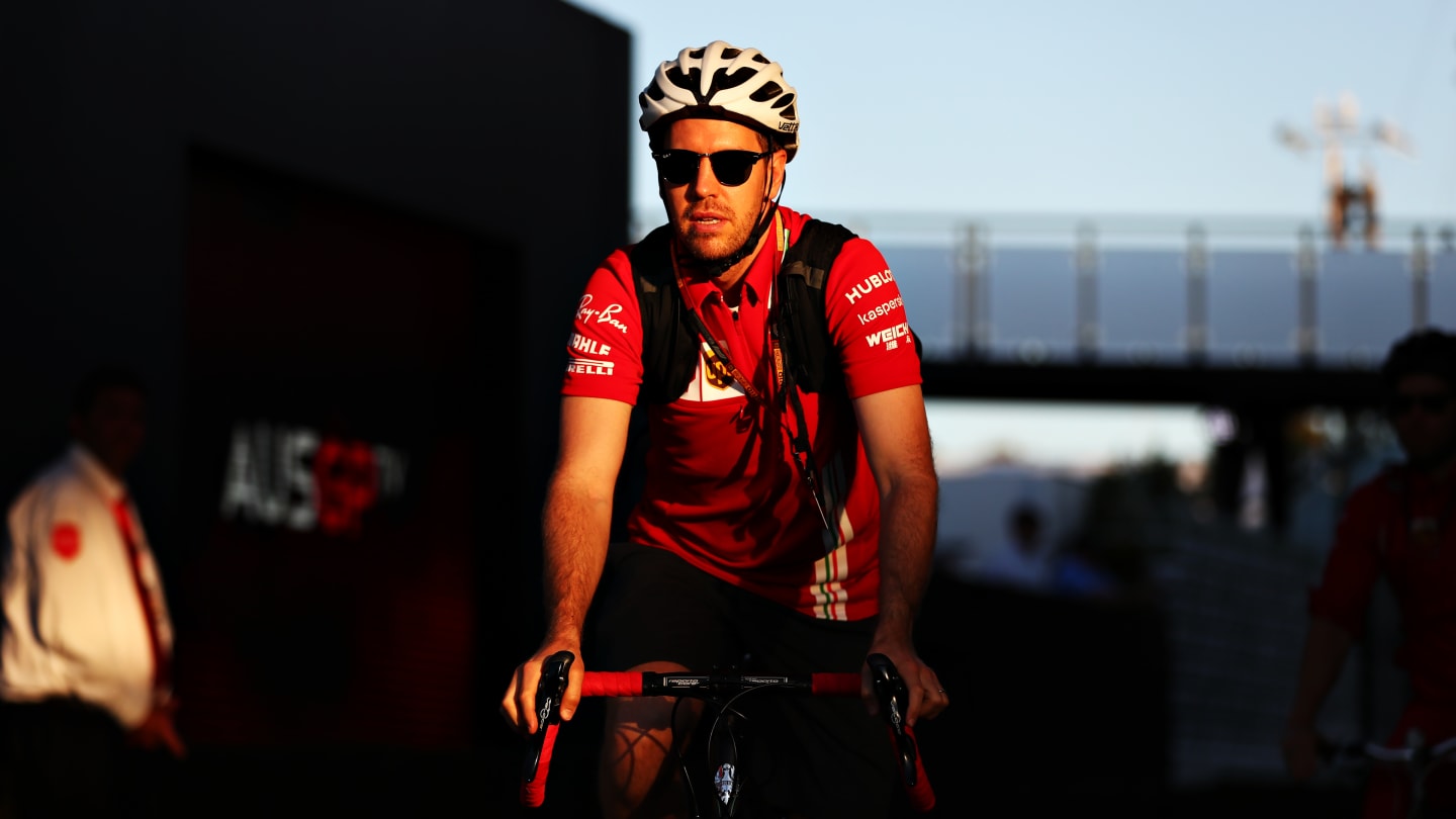 MELBOURNE, AUSTRALIA - MARCH 12: Sebastian Vettel of Germany and Ferrari leaves the circuit on a