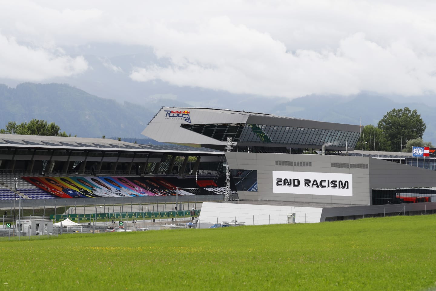 SPIELBERG, AUSTRIA - JULY 03: A general view of an empty grandstand and the pitlane building which