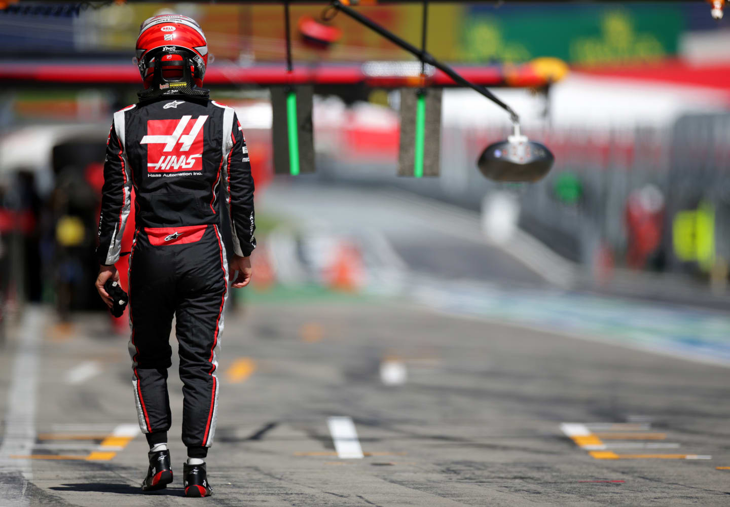 SPIELBERG, AUSTRIA - JULY 04:  Kevin Magnussen of Denmark and Haas F1 walks through the pit lane during qualifying for the Formula One Grand Prix of Austria at Red Bull Ring on July 04, 2020 in Spielberg, Austria. (Photo by Peter Fox/Getty Images)
