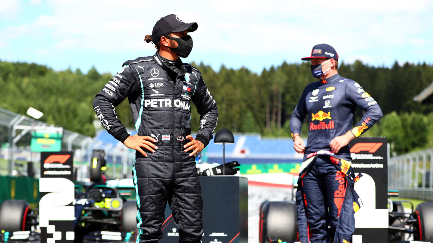 SPIELBERG, AUSTRIA - JULY 04:  Lewis Hamilton of Great Britain and Mercedes GP and Max Verstappen