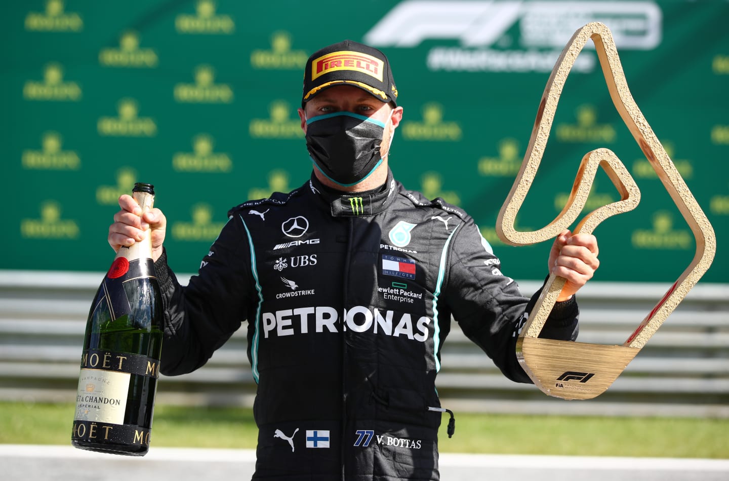 SPIELBERG, AUSTRIA - JULY 05: Race winner Valtteri Bottas of Finland and Mercedes GP poses with the