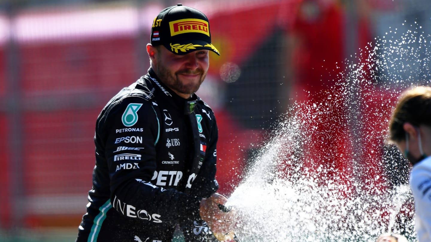 SPIELBERG, AUSTRIA - JULY 05: Race winner Valtteri Bottas of Finland and Mercedes GP celebrates on the podium during the Formula One Grand Prix of Austria at Red Bull Ring on July 05, 2020 in Spielberg, Austria. (Photo by Mario Renzi - Formula 1/Formula 1 via Getty Images)