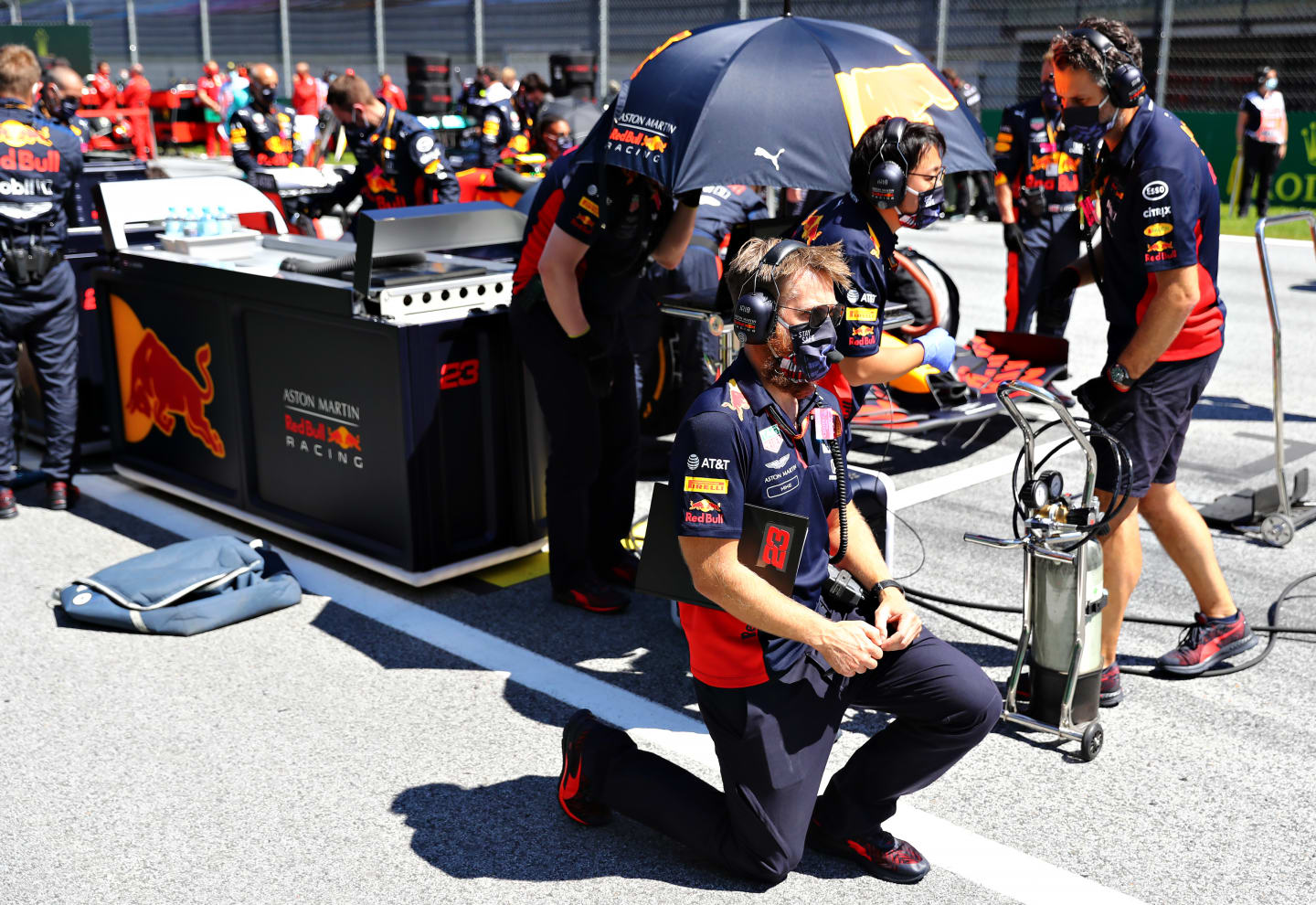 SPIELBERG, AUSTRIA - JULY 05: Red Bull Racing race engineer Mike Lugg takes a knee in support of