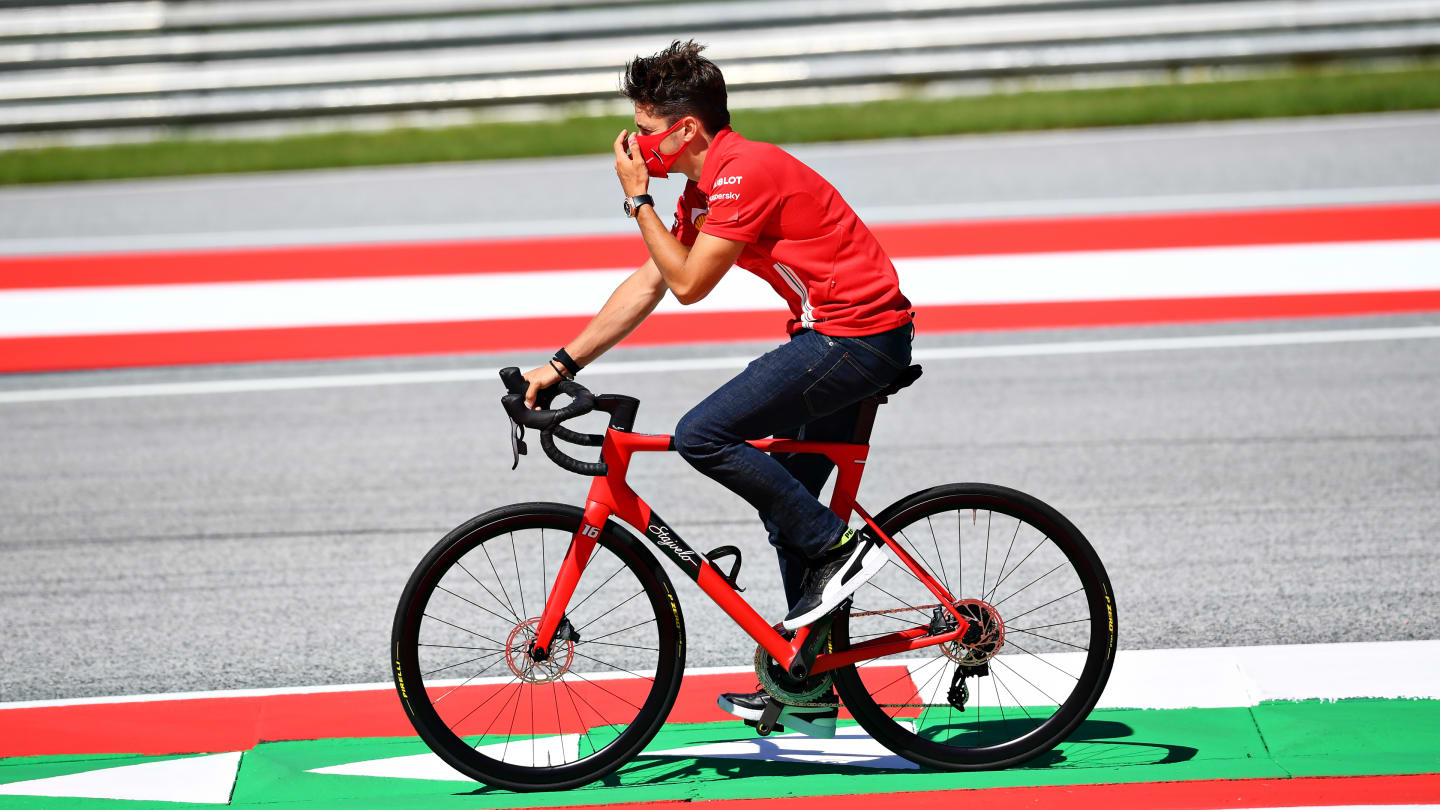 SPIELBERG, AUSTRIA - JULY 02: Charles Leclerc of Monaco and Ferrari cycles the track with his team