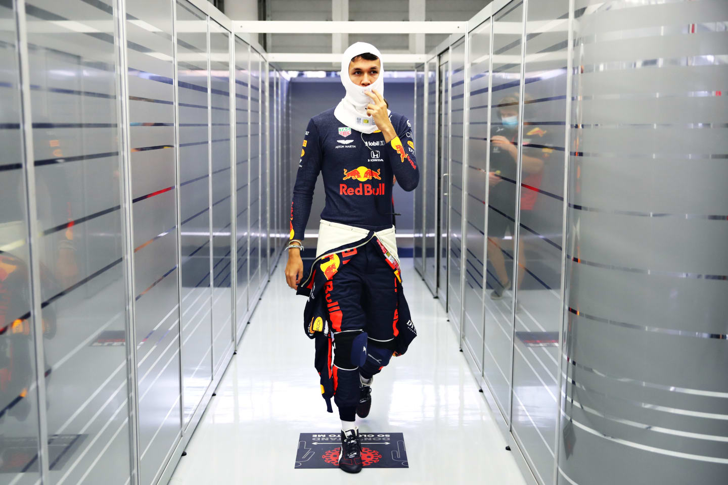 BAHRAIN, BAHRAIN - NOVEMBER 27: Alexander Albon of Thailand and Red Bull Racing walks in the garage
