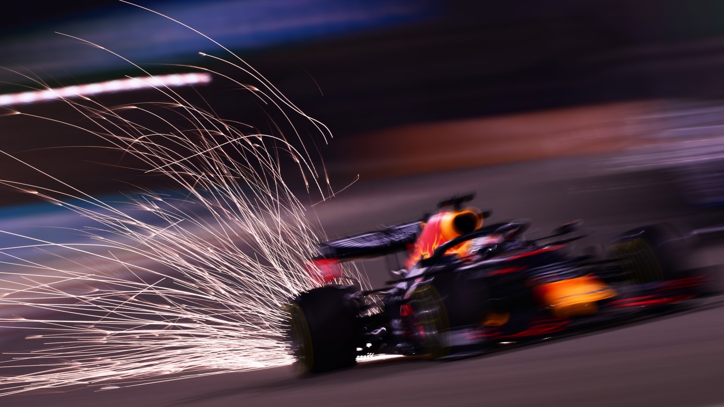 BAHRAIN, BAHRAIN - NOVEMBER 27: Sparks fly behind Max Verstappen of the Netherlands driving the