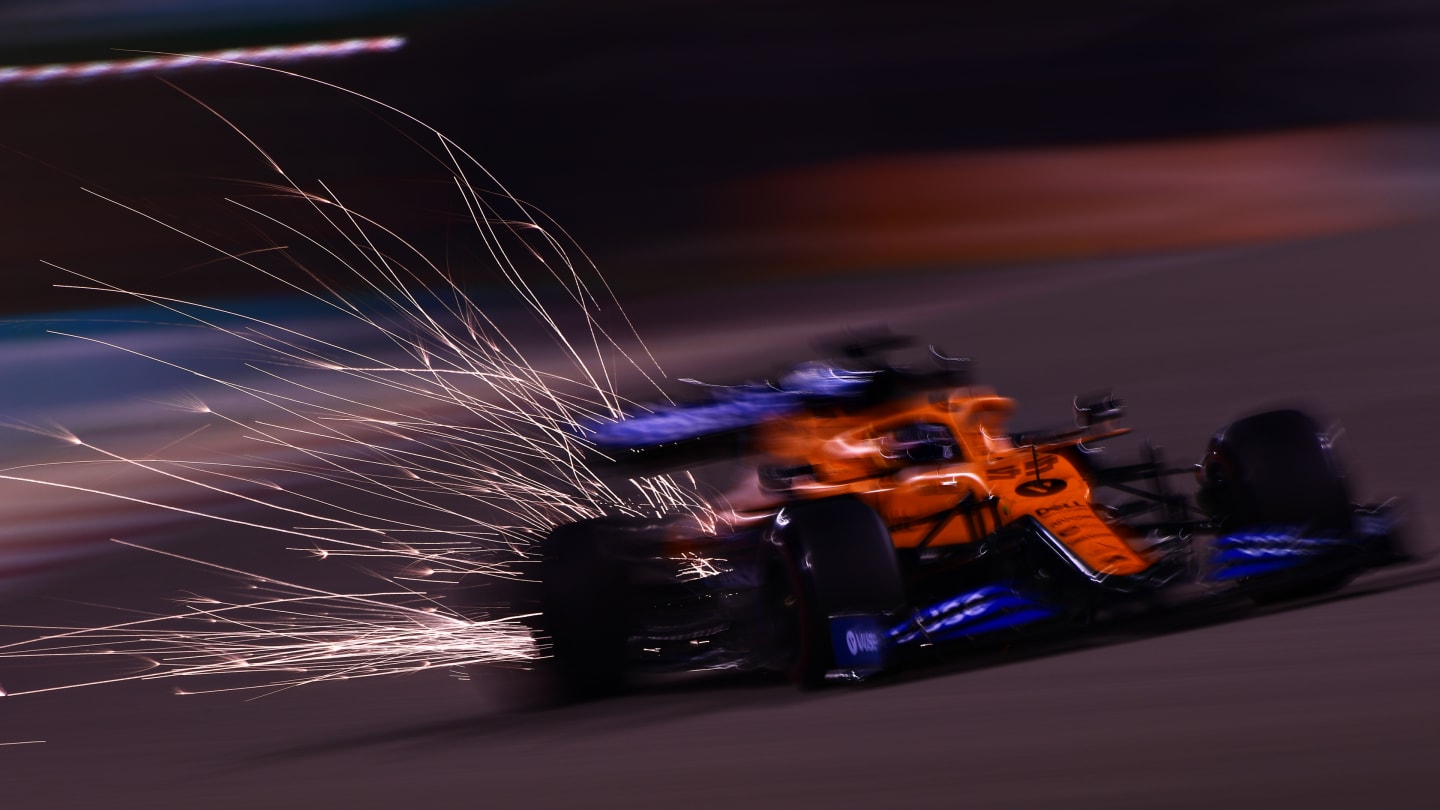 BAHRAIN, BAHRAIN - NOVEMBER 27: Sparks fly behind Carlos Sainz of Spain driving the (55) McLaren F1