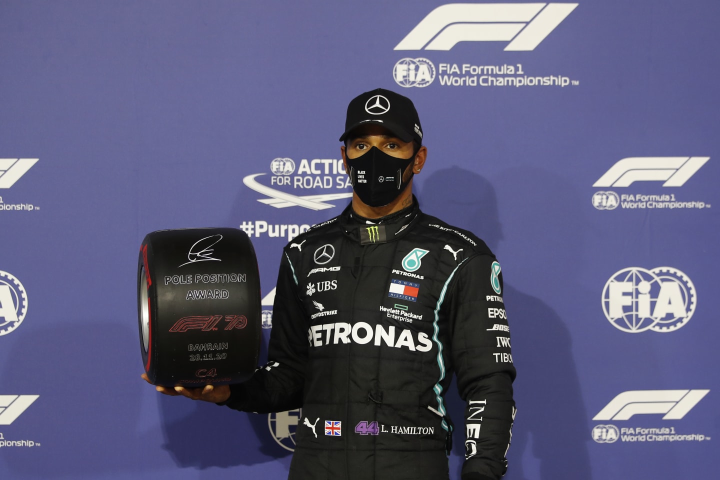 BAHRAIN, BAHRAIN - NOVEMBER 28: Pole position qualifier Lewis Hamilton of Great Britain and Mercedes GP poses with the pole position award in parc ferme during qualifying ahead of the F1 Grand Prix of Bahrain at Bahrain International Circuit on November 28, 2020 in Bahrain, Bahrain. (Photo by Hamad Mohammed - Pool/Getty Images)