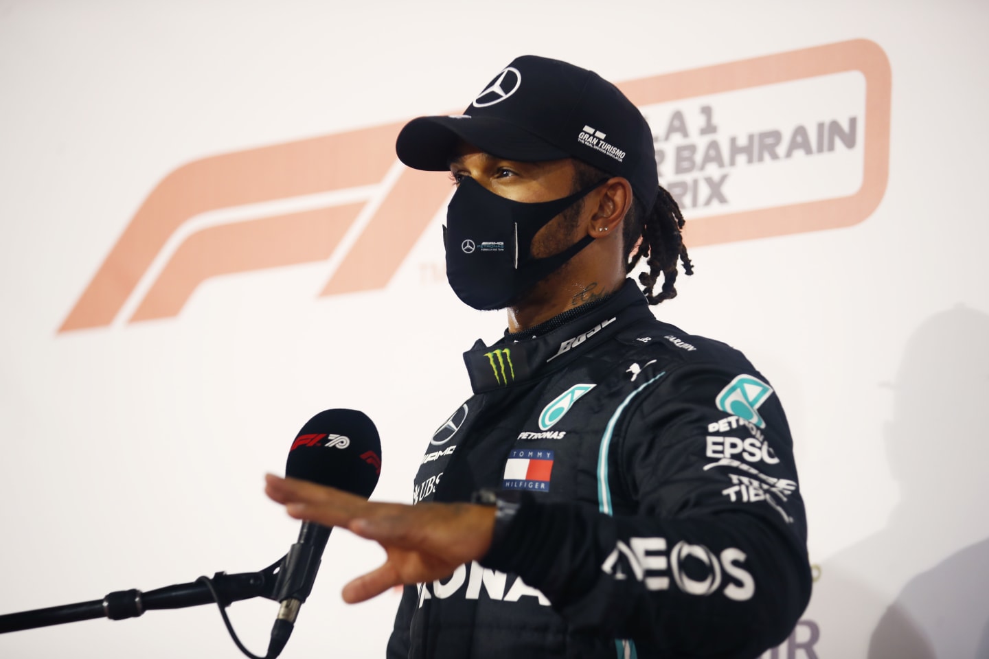 BAHRAIN, BAHRAIN - NOVEMBER 28: Pole position qualifier Lewis Hamilton of Great Britain and Mercedes GP talks to the media in parc ferme during qualifying ahead of the F1 Grand Prix of Bahrain at Bahrain International Circuit on November 28, 2020 in Bahrain, Bahrain. (Photo by Hamad Mohammed - Pool/Getty Images)