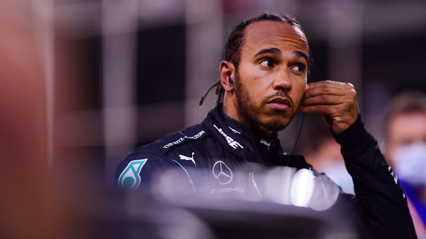 BAHRAIN, BAHRAIN - NOVEMBER 29: Lewis Hamilton of Great Britain and Mercedes GP looks on from the