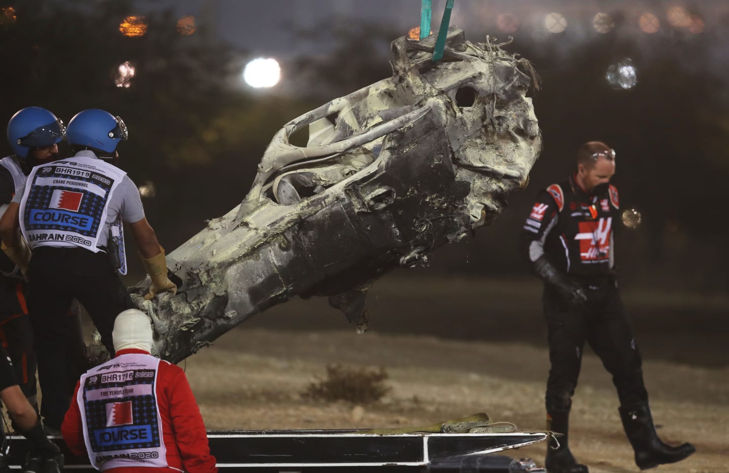 BAHRAIN, BAHRAIN - NOVEMBER 29: Track marshals clear the debris following the crash of Romain