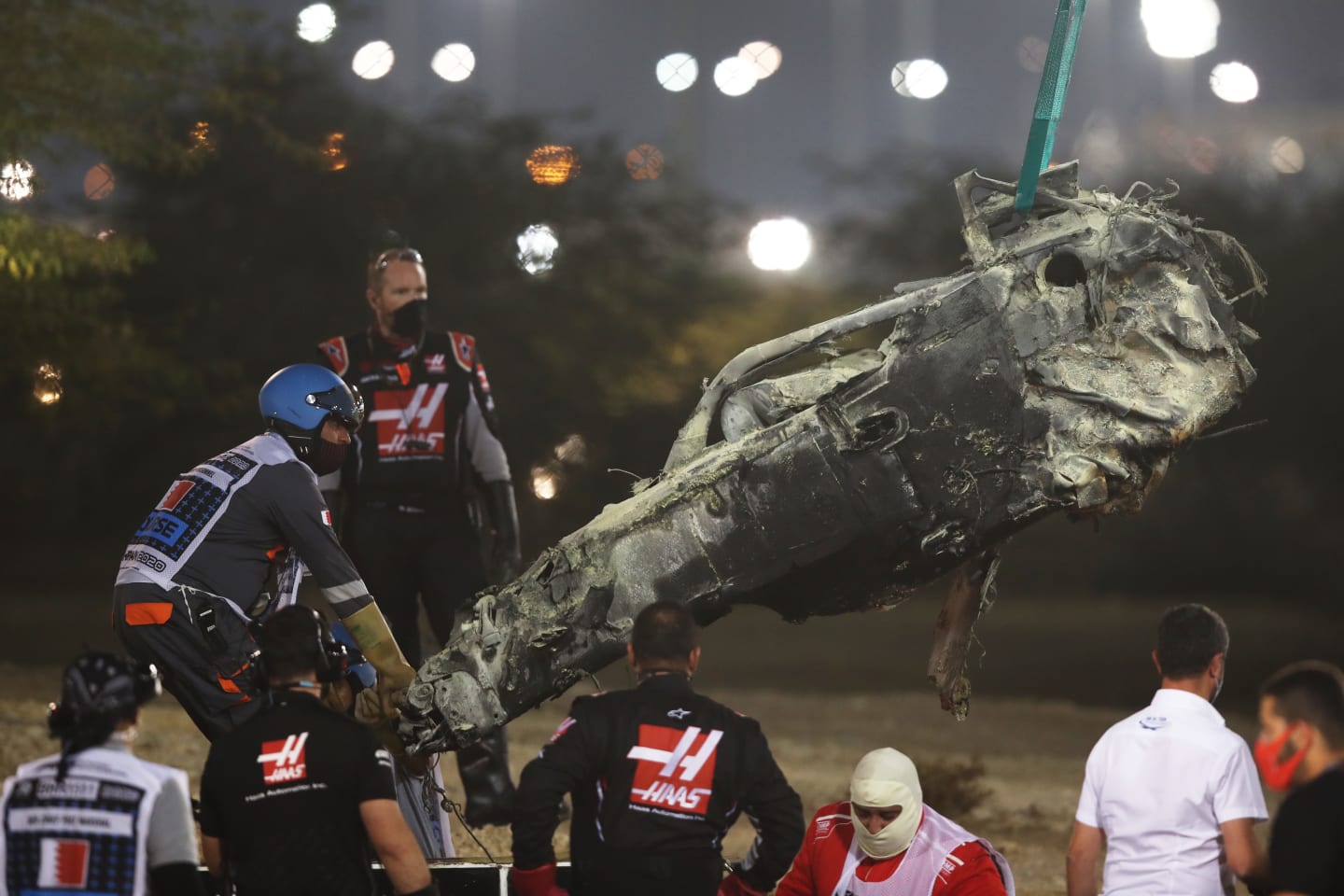 BAHRAIN, BAHRAIN - NOVEMBER 29: Track marshals clear the debris following the crash of Romain