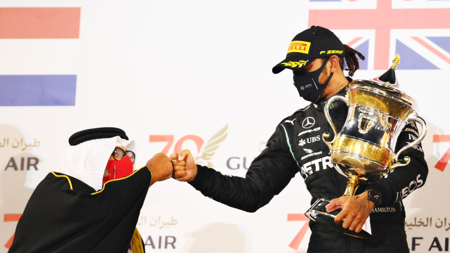 BAHRAIN, BAHRAIN - NOVEMBER 29: Race winner Lewis Hamilton of Great Britain and Mercedes GP celebrates on the podium during the F1 Grand Prix of Bahrain at Bahrain International Circuit on November 29, 2020 in Bahrain, Bahrain. (Photo by Clive Mason - Formula 1/Formula 1 via Getty Images)