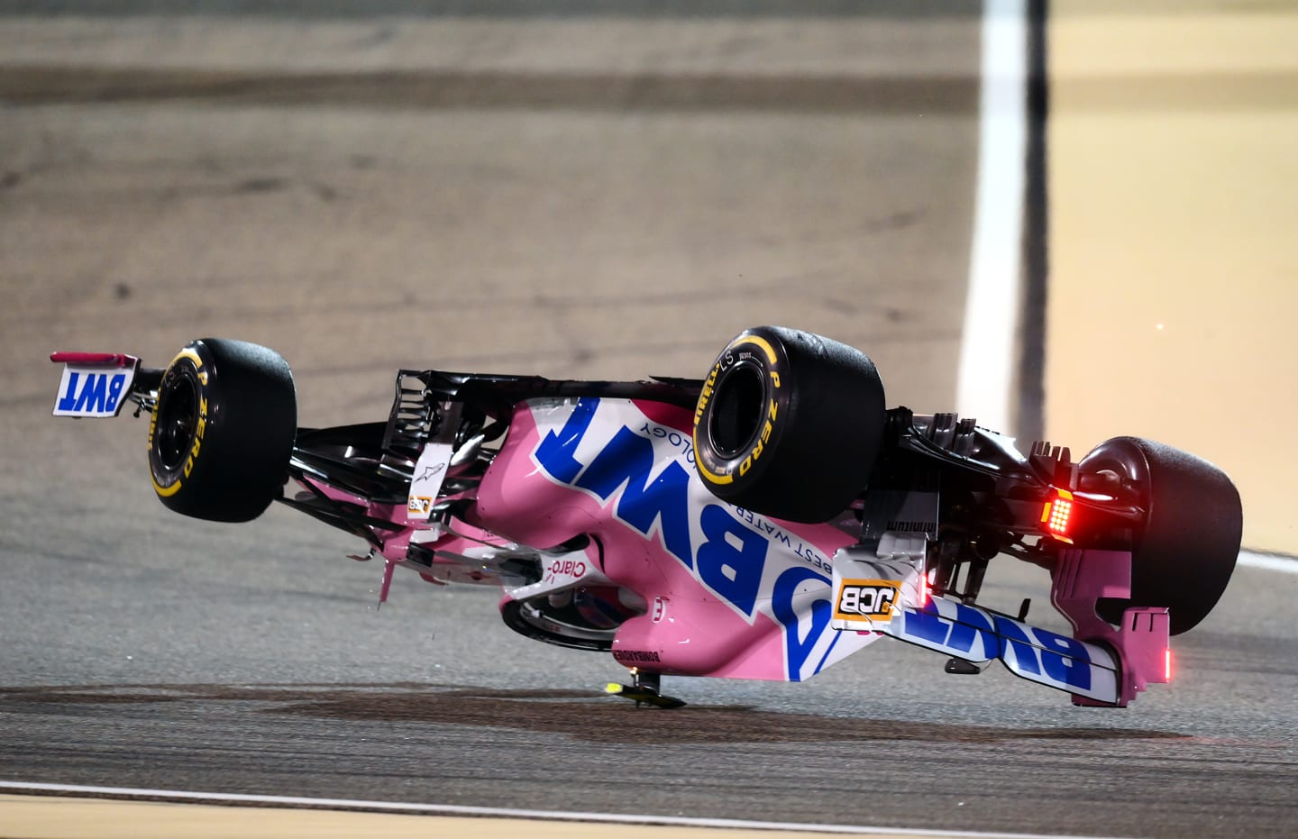 BAHRAIN, BAHRAIN - NOVEMBER 29: Lance Stroll of Canada driving the (18) Racing Point RP20 Mercedes is launched upside down following a crash during the F1 Grand Prix of Bahrain at Bahrain International Circuit on November 29, 2020 in Bahrain, Bahrain. (Photo by Clive Mason - Formula 1/Formula 1 via Getty Images)