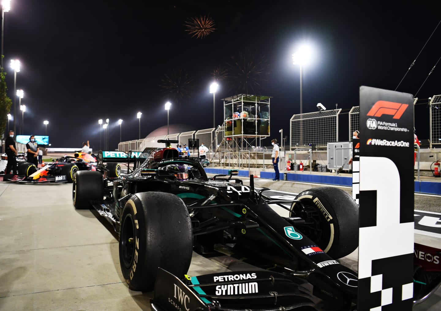 BAHRAIN, BAHRAIN - NOVEMBER 29: Race winner Lewis Hamilton of Great Britain and Mercedes GP stops