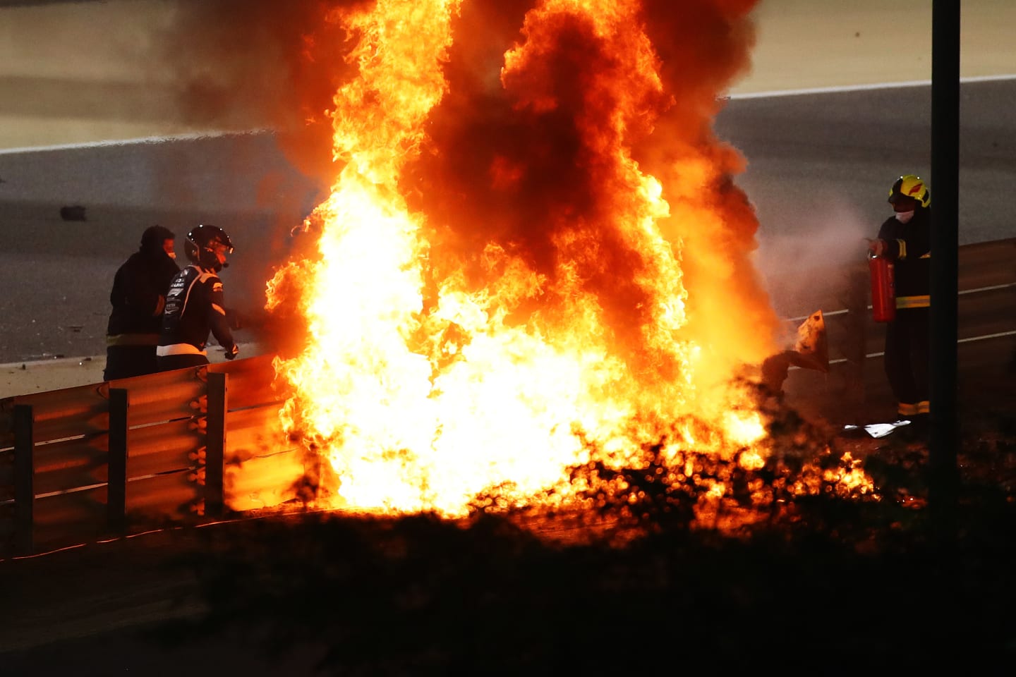BAHRAIN, BAHRAIN - NOVEMBER 29: A fire is pictured following the crash of Romain Grosjean of France