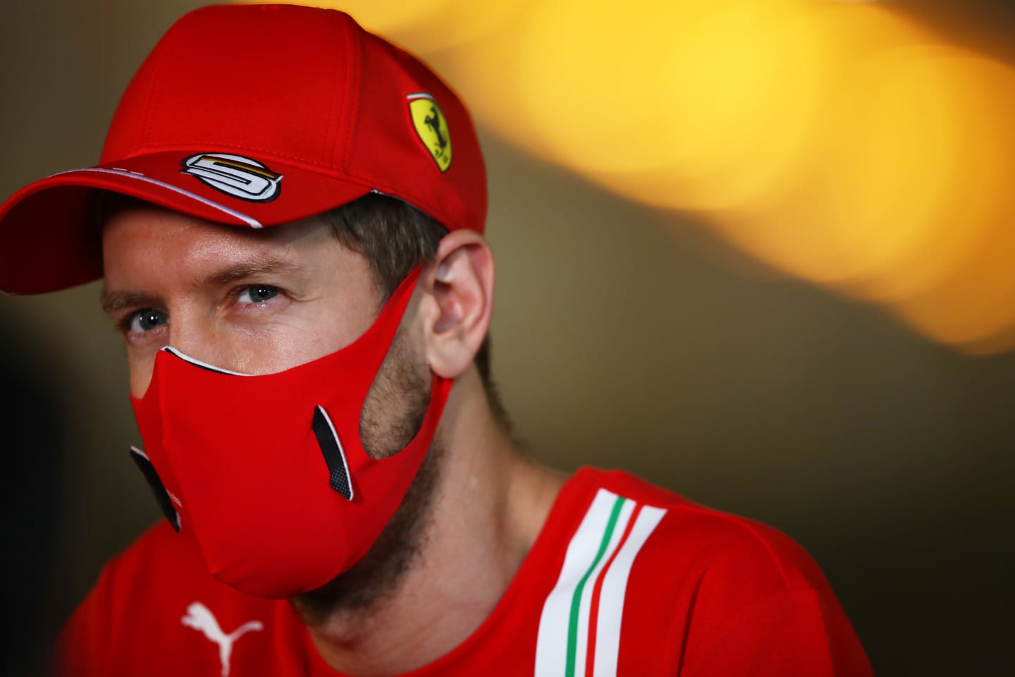 BAHRAIN, BAHRAIN - NOVEMBER 26: Sebastian Vettel of Germany and Ferrari looks on in the Paddock