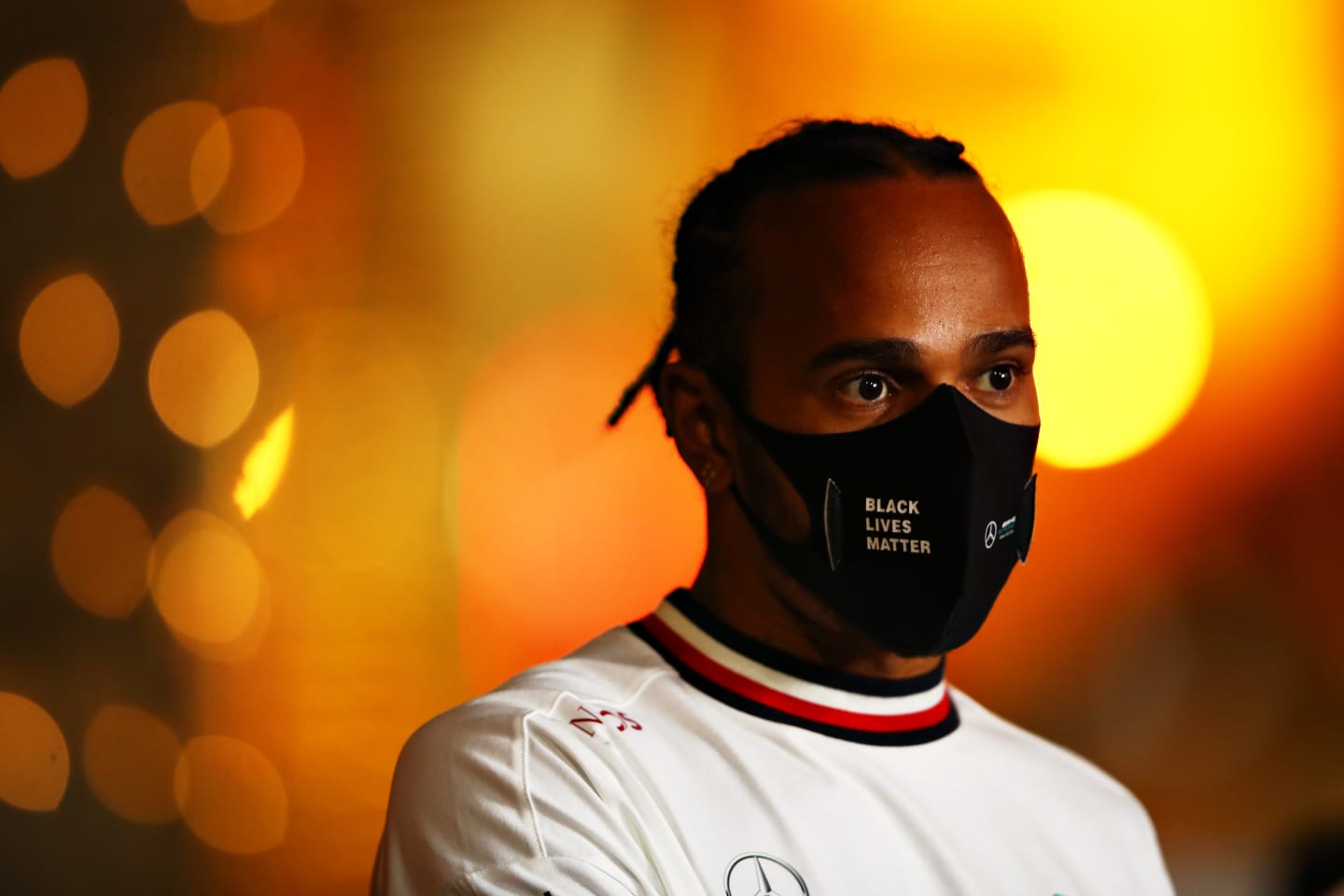 BAHRAIN, BAHRAIN - NOVEMBER 26: Lewis Hamilton of Great Britain and Mercedes GP talks to the media