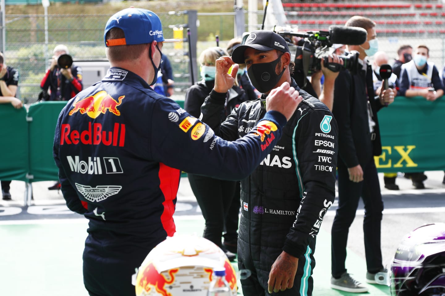 SPA, BELGIUM - AUGUST 29: Pole position qualifier Lewis Hamilton of Great Britain and Mercedes GP and third place qualifier Max Verstappen of Netherlands and Red Bull Racing talk in parc ferme during qualifying for the F1 Grand Prix of Belgium at Circuit de Spa-Francorchamps on August 29, 2020 in Spa, Belgium. (Photo by Francois Lenoir/Pool via Getty Images)