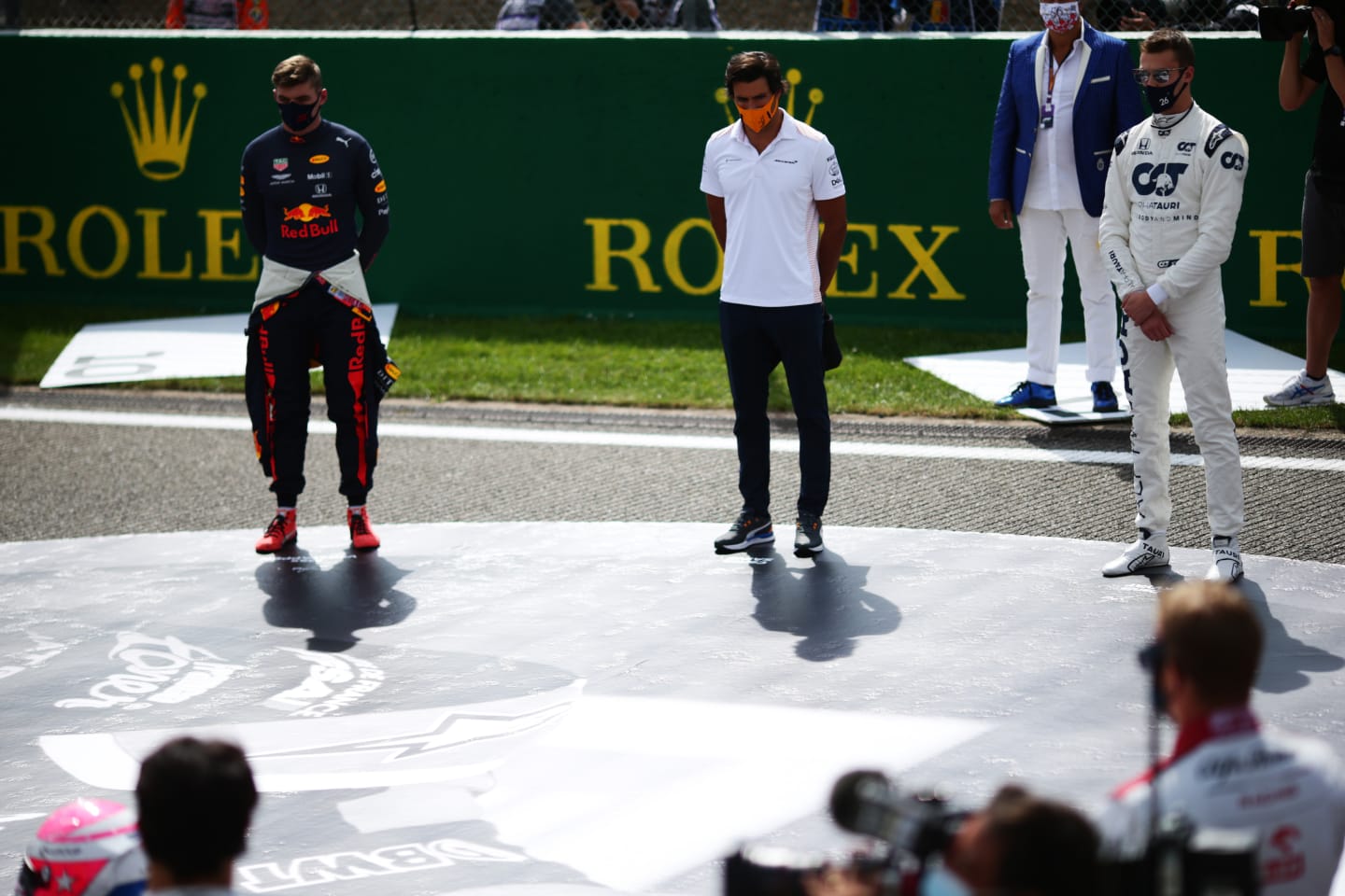 SPA, BELGIUM - AUGUST 30: Max Verstappen of Netherlands and Red Bull Racing, Carlos Sainz of Spain and McLaren F1 and Daniil Kvyat of Russia and Scuderia AlphaTauri take part in a minute of silence in tribute to the late Anthoine Hubert before the F1 Grand Prix of Belgium at Circuit de Spa-Francorchamps on August 30, 2020 in Spa, Belgium. (Photo by Peter Fox/Getty Images)