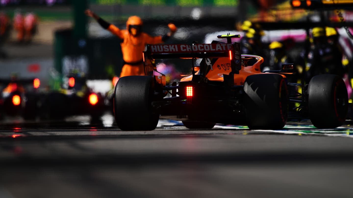 SPA, BELGIUM - AUGUST 30: Lando Norris of Great Britain driving the (4) McLaren F1 Team MCL35 Renault makes a pitstop for new tyres during the F1 Grand Prix of Belgium at Circuit de Spa-Francorchamps on August 30, 2020 in Spa, Belgium. (Photo by Mario Renzi - Formula 1/Formula 1 via Getty Images)