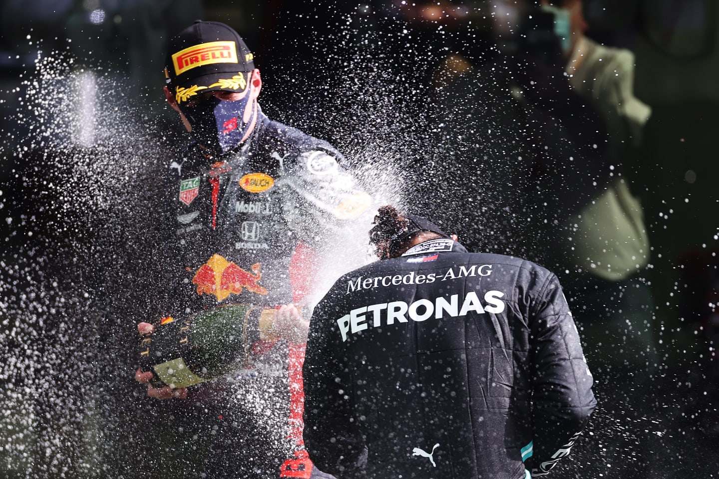 SPA, BELGIUM - AUGUST 30: Race winner Lewis Hamilton of Great Britain and Mercedes GP and Third placed Max Verstappen of Netherlands and Red Bull Racing celebrate on the podium during the F1 Grand Prix of Belgium at Circuit de Spa-Francorchamps on August 30, 2020 in Spa, Belgium. (Photo by Lars Baron/Getty Images)