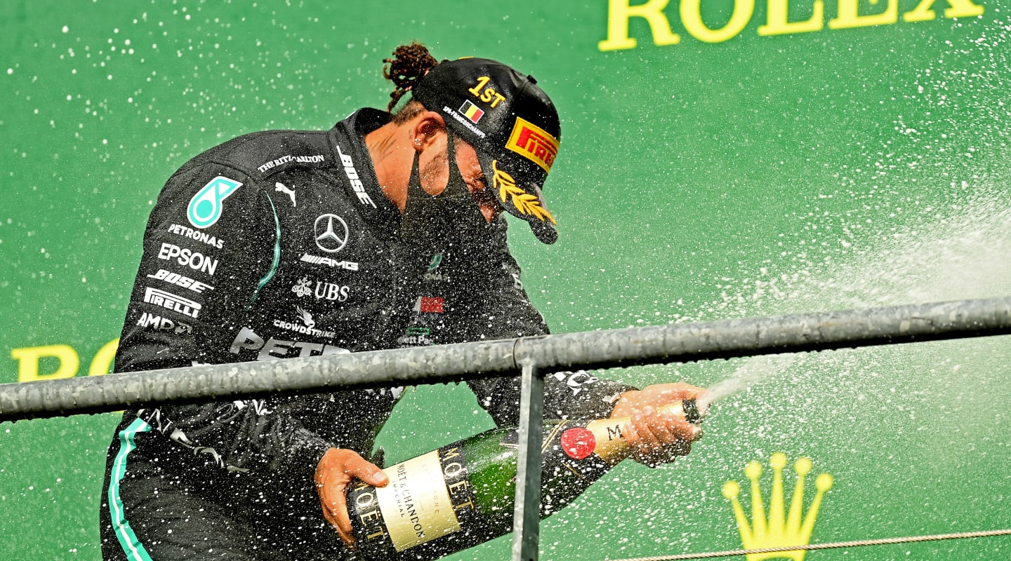 SPA, BELGIUM - AUGUST 30: Race winner Lewis Hamilton of Great Britain and Mercedes GP celebrates on the podium during the F1 Grand Prix of Belgium at Circuit de Spa-Francorchamps on August 30, 2020 in Spa, Belgium. (Photo by Clive Mason - Formula 1/Formula 1 via Getty Images)