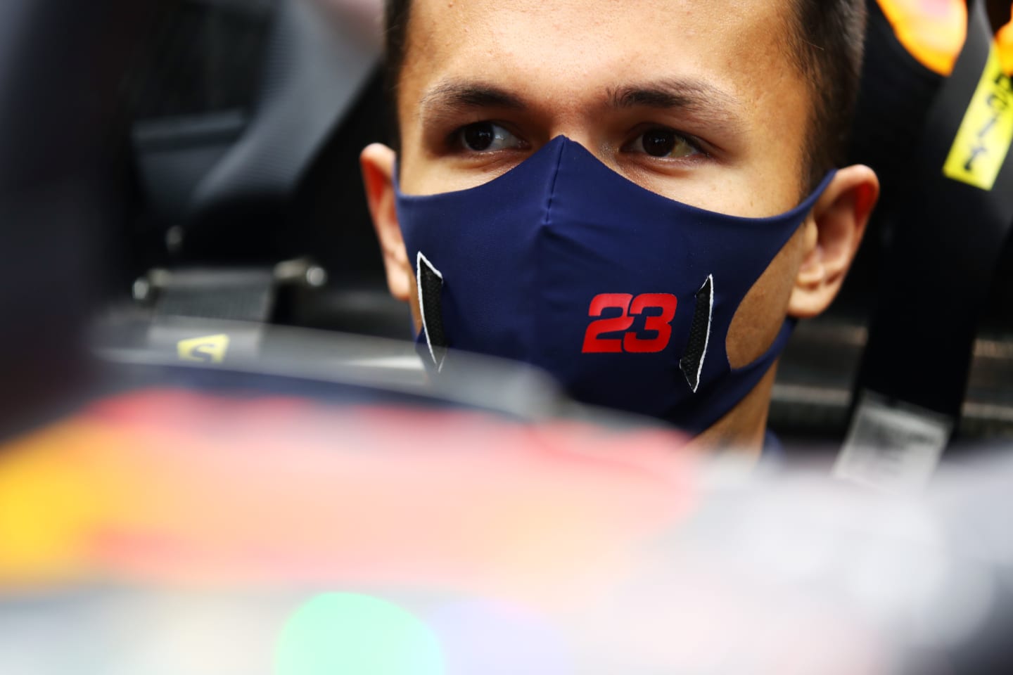 SPA, BELGIUM - AUGUST 27: Alexander Albon of Thailand and Red Bull Racing looks on in the garage