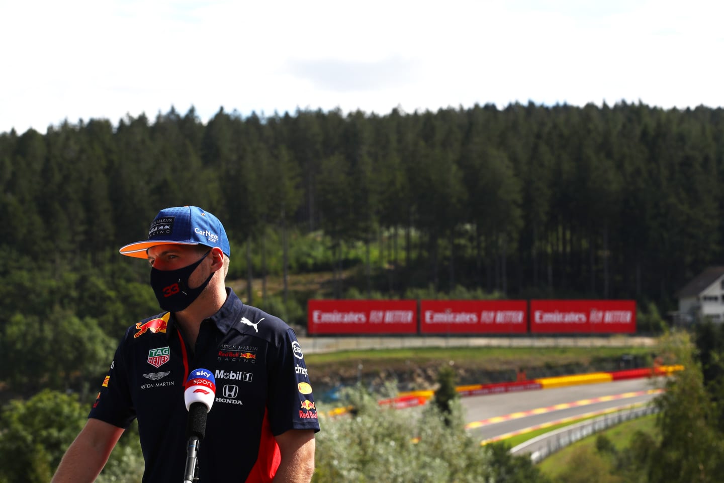 SPA, BELGIUM - AUGUST 27: Max Verstappen of Netherlands and Red Bull Racing looks on in the Paddock
