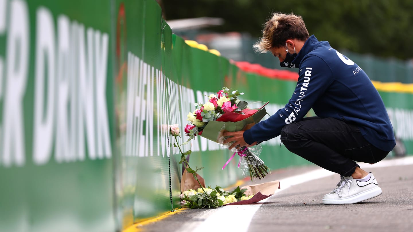 SPA, BELGIUM - AUGUST 27: Pierre Gasly of France and Scuderia AlphaTauri leaves flowers at the side