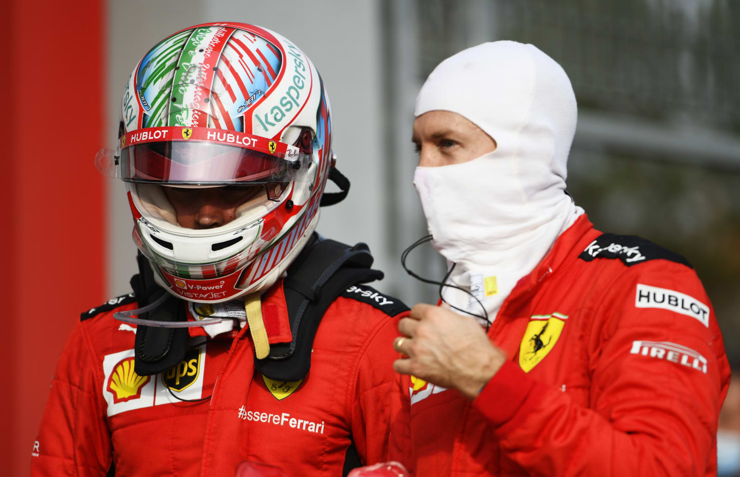 IMOLA, ITALY - NOVEMBER 01: Charles Leclerc of Monaco and Ferrari speaks with teammate Sebastian Vettel of Germany and Ferrari in parc ferme during the F1 Grand Prix of Emilia Romagna at Autodromo Enzo e Dino Ferrari on November 01, 2020 in Imola, Italy. (Photo by Rudy Carezzevoli/Getty Images)
